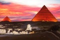 Illuminated Pyramids of Egypt and the great Sphinx night view, Giza Royalty Free Stock Photo