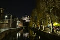 Quays of Lieve canal with Castle of the counts in the background in Ghent at night