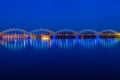Illuminated railway bridge at twilight. Riga, Latvia Royalty Free Stock Photo