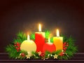 Illuminated realistic candles with pine leaves and holly berries