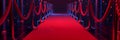 Illuminated red carpet path flanked by elegant rope barriers. VIP event red carpet walkway with ambient blue lighting. Red carpet Royalty Free Stock Photo