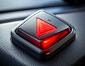 Illuminated red hazard warning triangle button on a car\'s dark textured dashboard light Royalty Free Stock Photo
