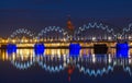 Illuminated Riga Railway bridge over river Daugava at night Royalty Free Stock Photo