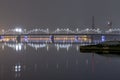 Illuminated Riga Railway bridge over river Daugava at night, Latvia. Royalty Free Stock Photo