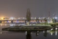 Illuminated Riga Railway bridge over river Daugava at night, Latvia. Royalty Free Stock Photo