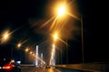 Illuminated road at night on the bridge