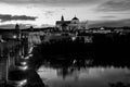 Illuminated Roman bridge and La Mezquita at sunset in Cordoba, Spain