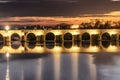 Illuminated Roman bridge over Guadalquivir river at evening in Cordoba, Andalusia, Spain