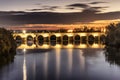 Illuminated Roman bridge over Guadalquivir river at evening in Cordoba, Andalusia, Spain