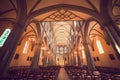 Illuminated Roman Catholic Church with Stained Glass Windows