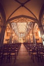 Illuminated Roman Catholic Church with Stained Glass Windows Royalty Free Stock Photo