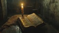Illuminated scripture resting on aged wooden table in dimly lit abandoned room Royalty Free Stock Photo