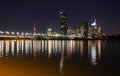 illuminated scyscrapers and their reflections in the water from the danube in vienna Royalty Free Stock Photo