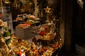 Illuminated showcase with Christmas gifts, retro and vintage decoration in dark evening. Christmas window shopping in side street