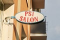 Illuminated sign with the inscription Psi Salon pet hairdresser in Kolobrzeg in Poland