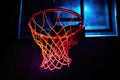 Illuminated Slam Dunk: A close-up of a basketball hoop, bathed in vibrant sports hues against a dark canvas Royalty Free Stock Photo