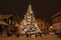 Illuminated, snowy Christmas tree with decorations, Kuldiga, Latvia