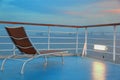 Illuminated solitary deck-chair on ship Royalty Free Stock Photo