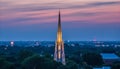 Illuminated spires silhouette city skyline at twilight, a gothic monument generated by AI