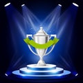 Illuminated sport cup on podium - winner award ceremony stage Royalty Free Stock Photo