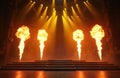 Illuminated stage with vibrant lights, fire effects. Energetic show features theatrical flames on dark backdrop. Intense Royalty Free Stock Photo