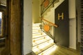 Illuminated stairs in empty corridor