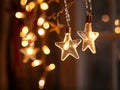 Illuminated Star-Shaped Christmas Lights Hanging Against a Blurry Background Royalty Free Stock Photo