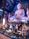 Illuminated statue of Buddha at Wat Rong Suea Ten Blue Temple at Chiang Rai Thailand