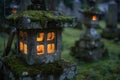 Illuminated stone lantern in a serene garden at dusk Royalty Free Stock Photo