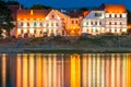 Illuminated street lights near the river