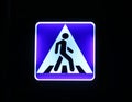 Illuminated street traffic sign - pedestrian crossing Royalty Free Stock Photo