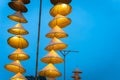 Illuminated stripe Vietnamese traditional conical hats hanging on wire for decoration, with blue sky at twilight Royalty Free Stock Photo