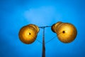 Illuminated stripe Vietnamese traditional conical hats hanging on wire for decoration, with blue sky at twilight Royalty Free Stock Photo