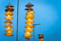 Illuminated stripe Vietnamese traditional conical hats hanging on wire for decoration, with blue sky at twilight Royalty Free Stock Photo