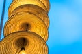 Illuminated stripe Vietnamese traditional conical hats hanging on wire for decoration, with blue sky at twilight Royalty Free Stock Photo