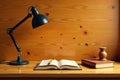 Illuminated study space featuring open book, pen, desk lamp, and wooden object. Generative AI Royalty Free Stock Photo
