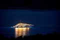 Illuminated superyacht on the sea night view, summer leisure