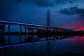 Illuminated suspended bridge in the darkness Royalty Free Stock Photo