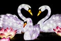 Illuminated swan sculptures at Lightopia in Crystal Palace park, London