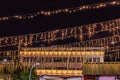 Illuminated swing chain carousel in amusement park at night Royalty Free Stock Photo