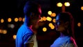 Illuminated teenager boy and girl looking at each other with love, affection Royalty Free Stock Photo