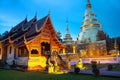 Illuminated temples of Wat Phra Singh in Chiang Mai, Thailand at sunset Royalty Free Stock Photo