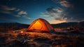 an illuminated tent stands alone in the dark mountains, only the moon shines