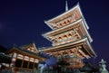 The illuminated three-storied pagoda and Sutra hall at night. Kiyomizu-dera temple. Kyoto. Japan Royalty Free Stock Photo