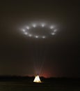 Illuminated Tipi, Teepee, at night Projecting Light into the Sky Royalty Free Stock Photo