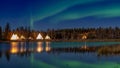 Illuminated Tipi & x28;indian Tent& x29; with water reflection during Aurora borealis