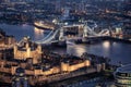 The illuminated Tower and the Tower Bridge of London by night Royalty Free Stock Photo