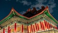 Illuminated traditional Asian building in an urban setting at night