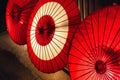 illuminated traditional red paper umbrellas in Kyoto, Japan