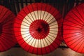 illuminated traditional red paper umbrellas in Kyoto, Japan